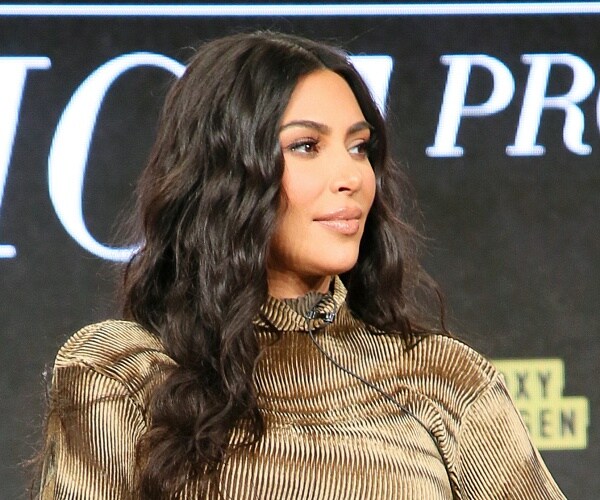 kim kardashian sits onstage