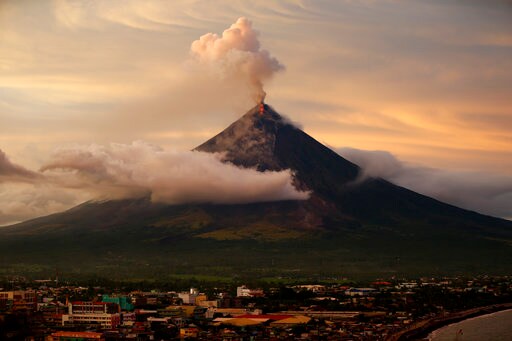 Lava Spilling from Philippine Volcano, Ash Coating Land