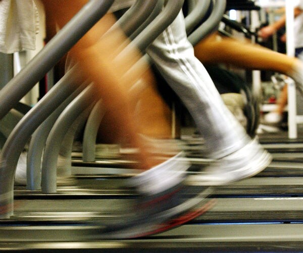 a closeup of runners on a treadmill