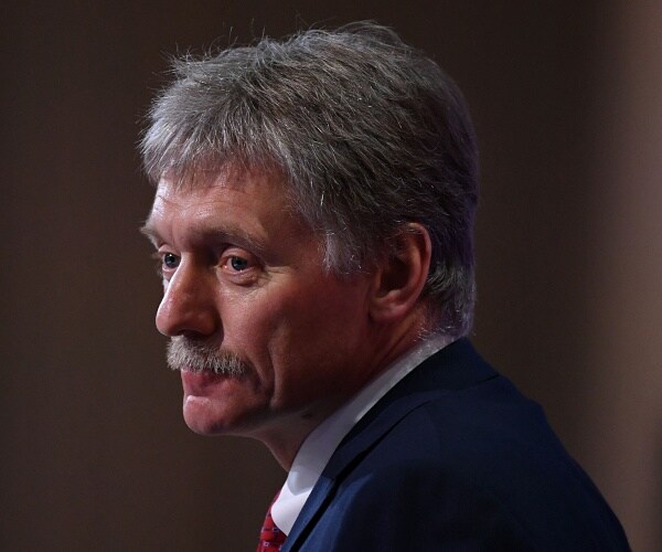 dmitry pesko sits in press conference