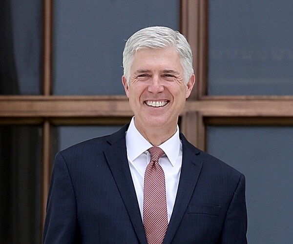 neil gorsuch stands on steps of supreme court