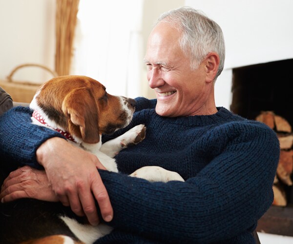 a senior man with his dog