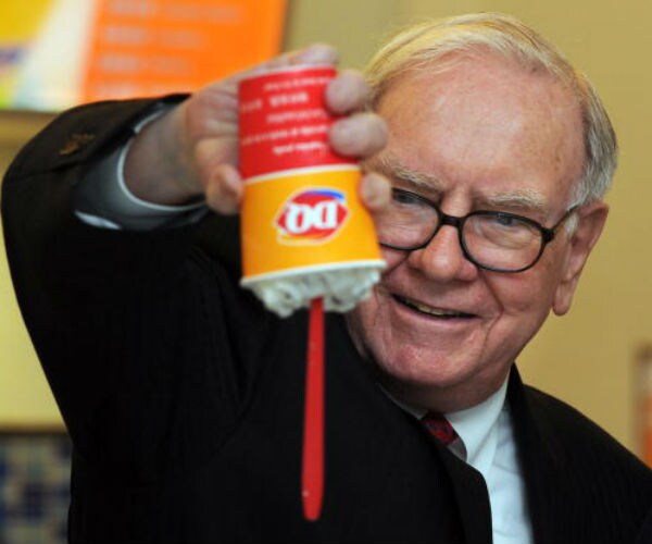 Buffett's Pay Rises; Berkshire Urges Rejection of Shareholder Proposals