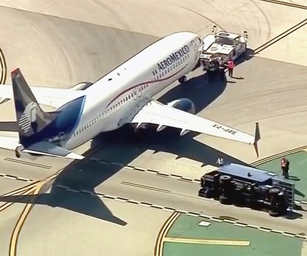 LAX Plane, Supply Truck Get Too Flipping Near