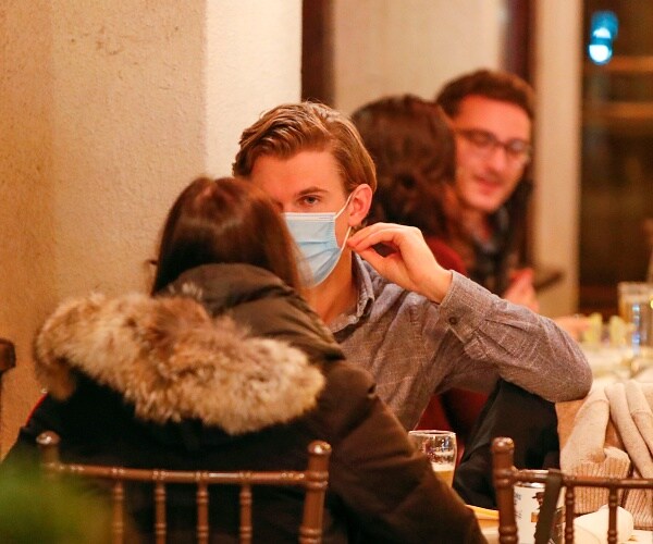 customers sit outside at restaurant