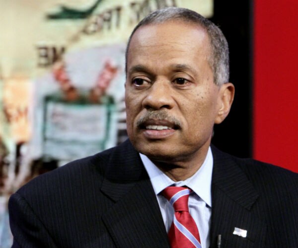 juan williams, dressed in black suit, red and blue stripped tie and white dress shirt on fox news