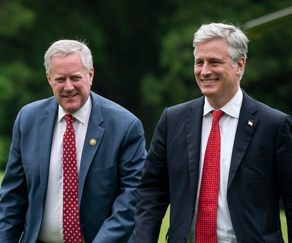 mark meadows and robert o'brien walk across the white house lawn