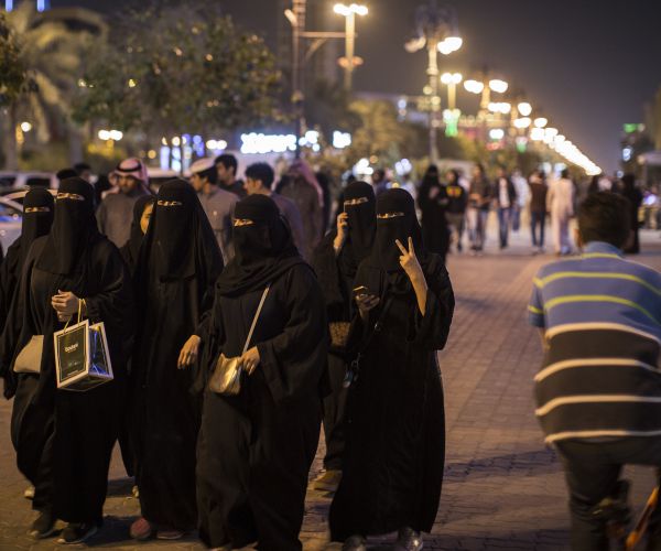 a saudi arabian women on a commercial street in riyadh, saudi arabia.