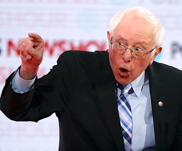 bernie sanders points and exults during the democratic presidential primary debate