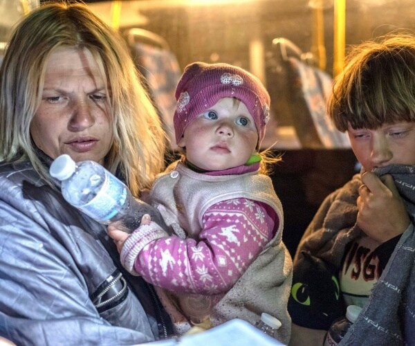 a mother and her kids evacuated from mariupol