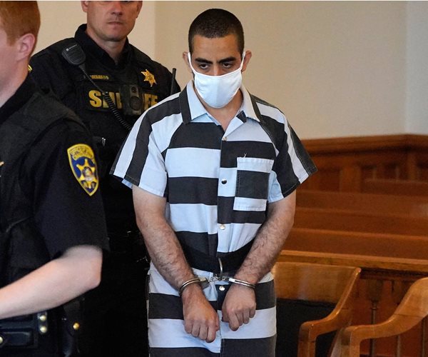 hadi matar escorted by police in a courtroom