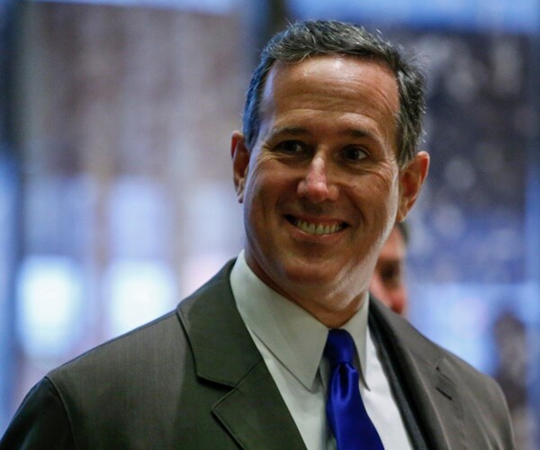 rick santorum smiles at the media in trump tower