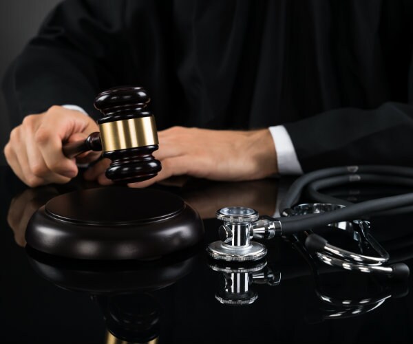 Prosecutor Says Pharmacist Disregarded Safety in Outbreak