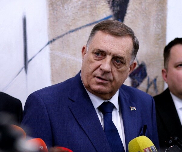 milorad dodik speaks to reporters.
