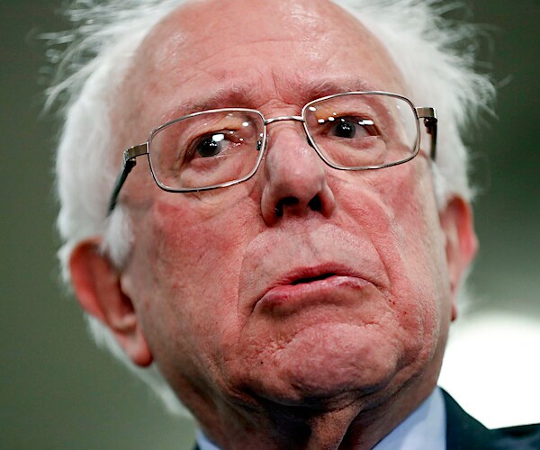 bernie sanders looks on incredulously during a media interview
