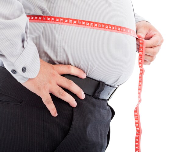 a man with a tape measure around his waist