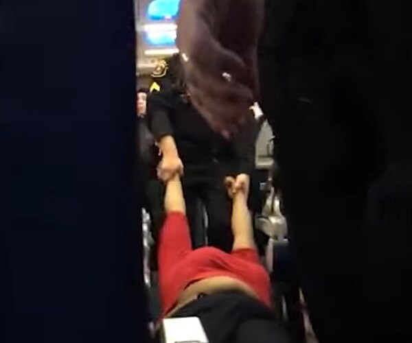 Woman Literally Dragged From Delta Flight