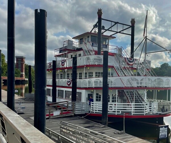 a riverboat sits docked 