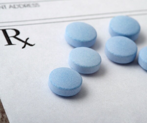 opioid pills on a prescription pad