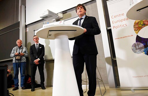 The Latest: Puigdemont Says he Hopes to Return to Catalonia