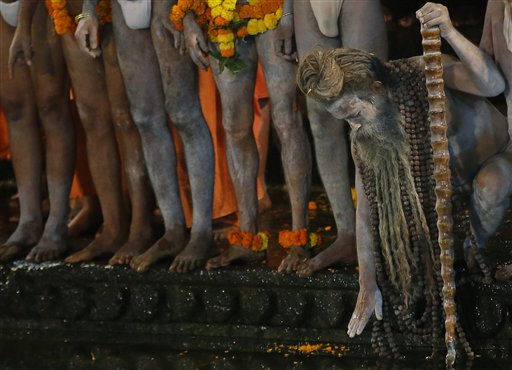 AP PHOTOS: Hindu Holy Men Lead Bath Rituals in Indian River