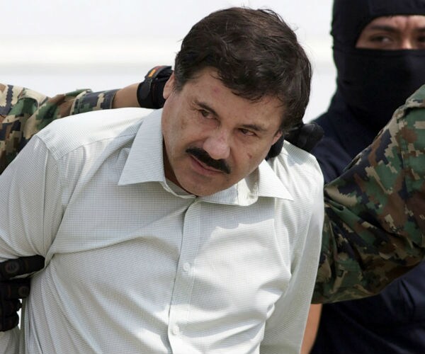  Joaquin "El Chapo" Guzman is shown being escorted by officers