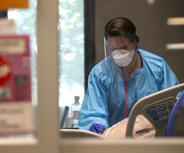 a nurse evaluates a covid-19 patient in a san jose california hospital