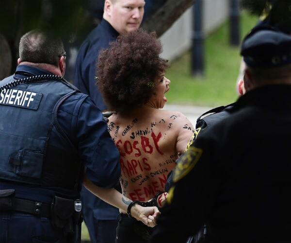 Topless Protester Gets Close to Bill Cosby as Retrial Begins