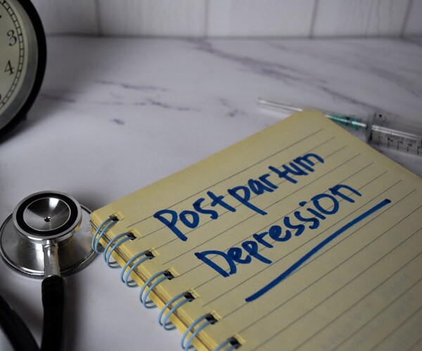 postpartum depression written in a notebook
