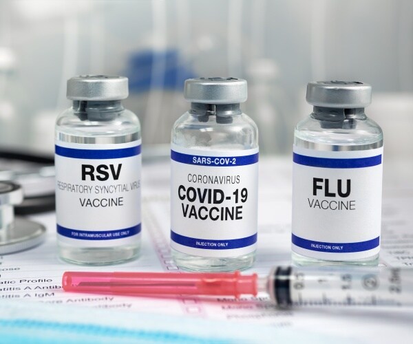 vials of vaccines for RSV, COVID, Flu, syringe