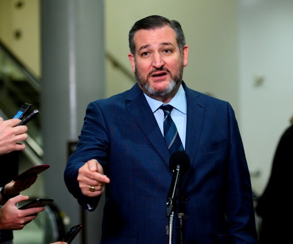 ted cruz in a suit and blue striped tie