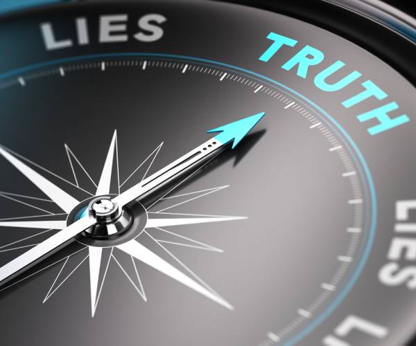 a compass pointing to the word truth