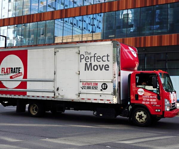 flatrate moving truck seen outside a building