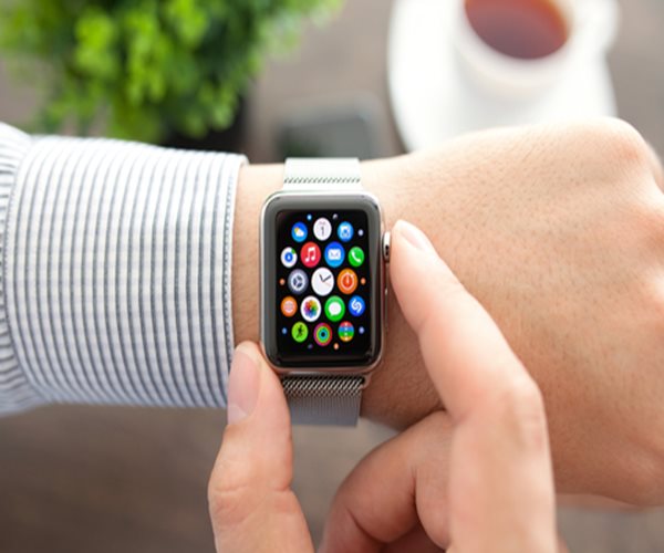 a closeup photo of an Apple watch on a person's wrist