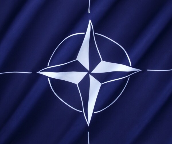 flag of the north atlantic treaty organization with blue color and white circle 