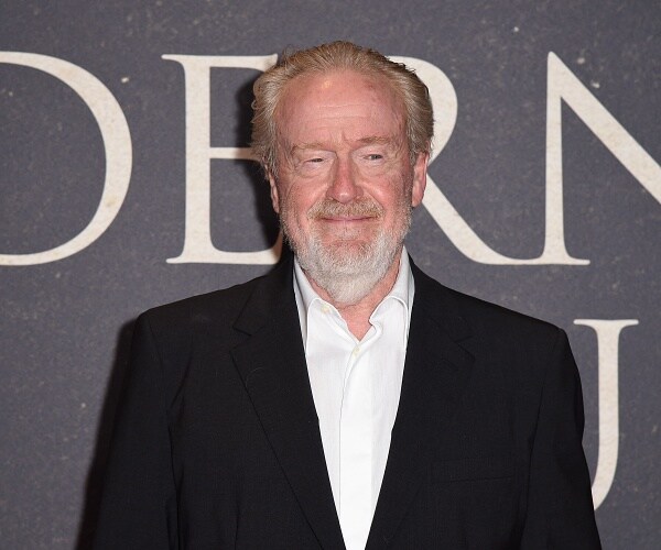ridley scott stands on red carpet