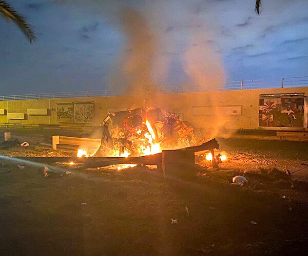 The remains of a vehicle hit by missiles outside Baghdad airport