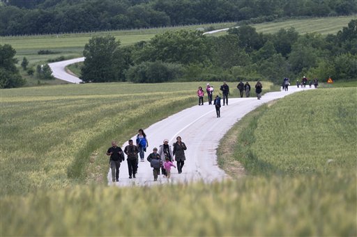 The Latest: 28 Refugees Arrive in Slovenia under EU Plan