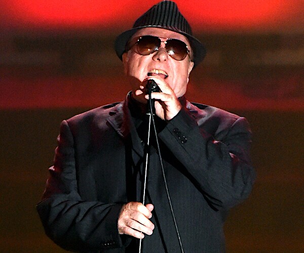 van morrison sings into a mic in twenty fifteen