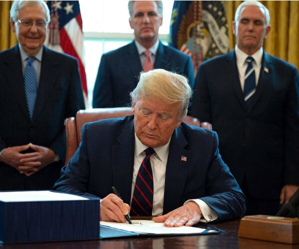 us president donald trump signs the cares act  