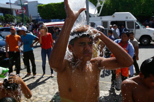 The Latest: Activist Says Hunger, Death to Blame for Caravan