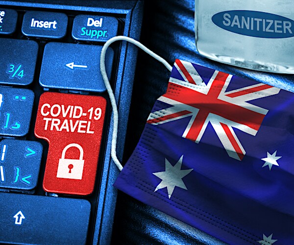 a keyboard with the enter key labeled travel and showing a locked icon with a facemask of an australia flag