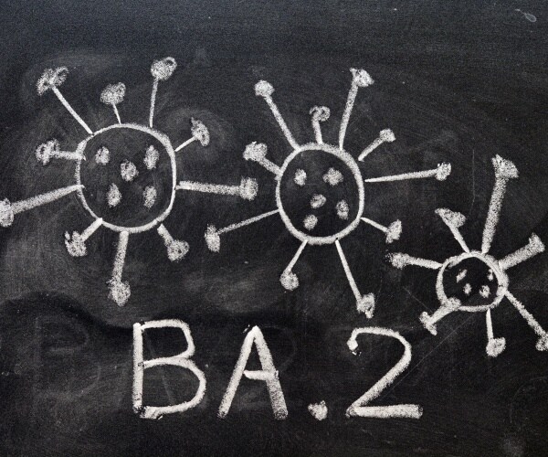 chalkboard says omicron BA.2 and three coronavirus particles