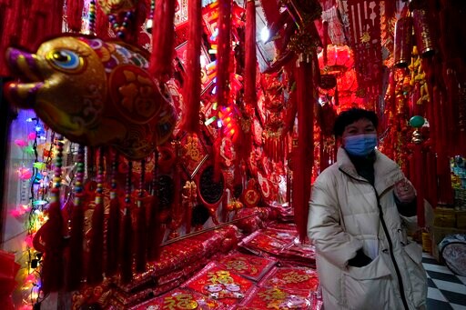 AP PHOTOS: Virus Uncertainty for China's Year of Ox Vendors