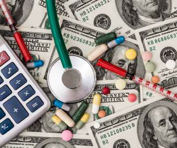 illustration shows 100 dollar bills surrounded by medications, a calculator and stethoscope 