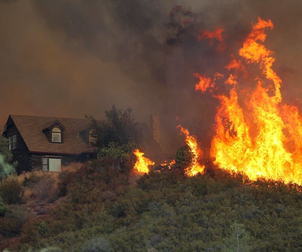 Firefighter Killed, Hundreds Flee as California Blazes Burn