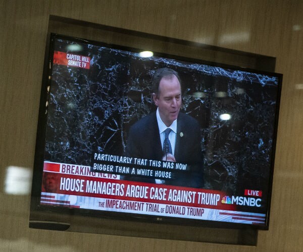 trump senate impeachment trial on tv screen in des moines iowa