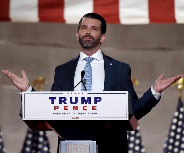 donald trump jr stands at podium