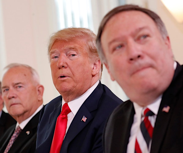 mike pompeo sits to the left of president donald trump at the cabinet table