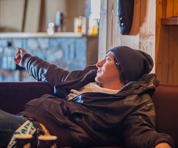 man lounging on couch